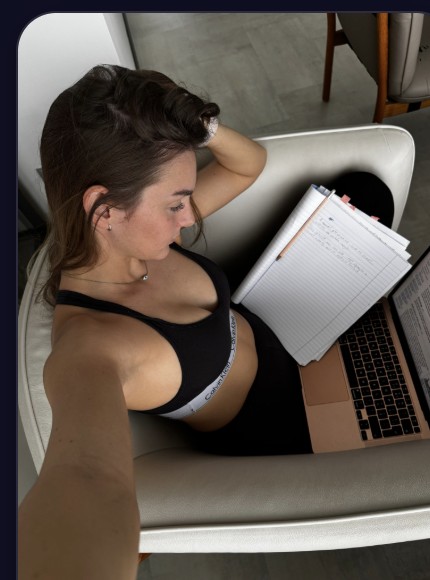 Nicole relaxing with her laptop and notes